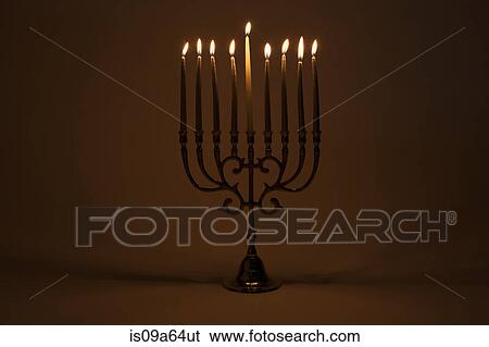Menorah with lit candles View Large Photo Image Stock Photograph - Menorah with lit candles. Fotosearch