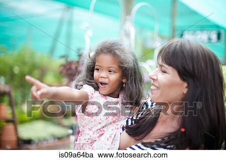 Mother and daughter pointing View Large Photo Image Stock Image - Mother and daughter pointing. Fotosearch