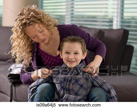 Mother and son smiling together View Large Photo Image Stock Photography - Mother and son smiling together. Fotosearch