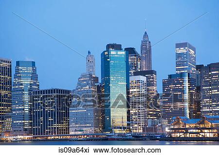 New York City skyline lit up at night View Large Photo Image Stock Image - New York City skyline lit up at night. Fotosearch
