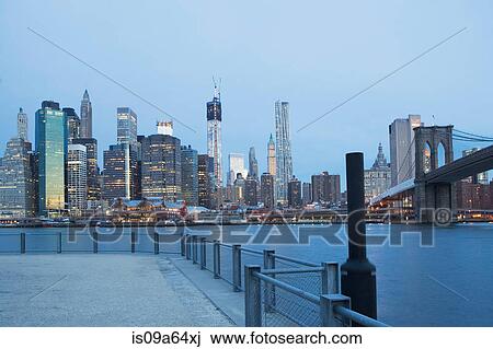 New York City skyline lit up at night View Large Photo Image Stock Image - New York City skyline lit up at night. Fotosearch