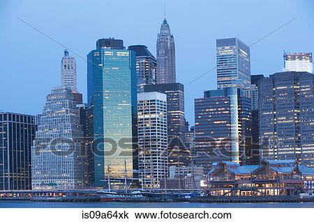 New York City skyline lit up at night View Large Photo Image Stock Image - New York City skyline lit up at night. Fotosearch