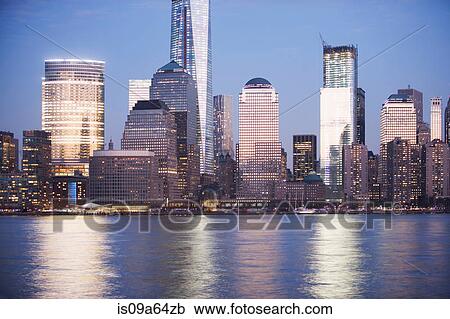 New York City skyline lit up at night View Large Photo Image Stock Image - New York City skyline lit up at night. Fotosearch