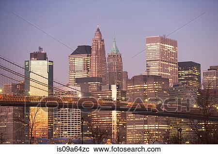 New York City skyline lit up at night View Large Photo Image Stock Image - New York City skyline lit up at night. Fotosearch