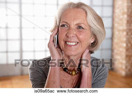 Older woman talking on cell phone View Large Photo Image Stock Image - Older woman talking on cell phone. Fotosearch