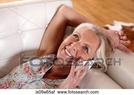 Older woman talking on cell phone View Large Photo Image Stock Image - Older woman talking on cell phone. Fotosearch