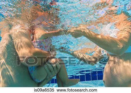 Parents and toddler in swimming pool View Large Photo Image Stock Photography - Parents and toddler in swimming pool. Fotosearch