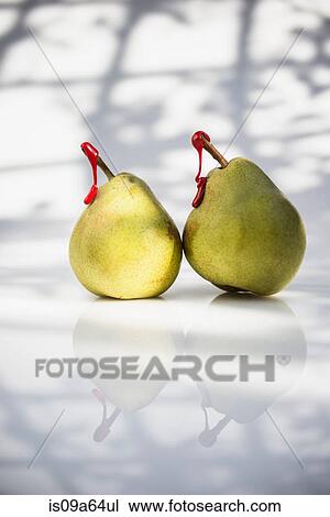 Stock Image - Pears with red tags on stems. Fotosearch