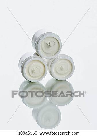 Pots of lotion stacked on counter View Large Photo Image Stock Image - Pots of lotion stacked on counter. Fotosearch