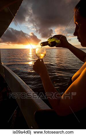 Stock Image - Pouring a cocktail. Fotosearch