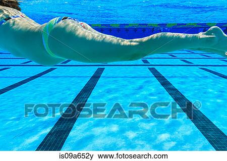 Stock Photo - Pregnant woman swimming in pool. Fotosearch