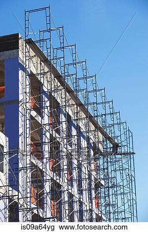 Stock Image - Scaffolding on side of building. Fotosearch
