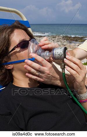 Stock Image - Scuba Diver breathes Oxygen. Fotosearch