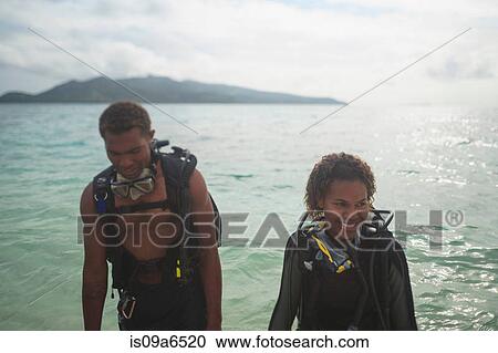 Scuba divers in tropical water View Large Photo Image Stock Image - Scuba divers in tropical water. Fotosearch