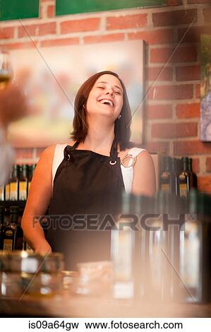 Server laughing in grocery store View Large Photo Image Stock Photo - Server laughing in grocery store. Fotosearch