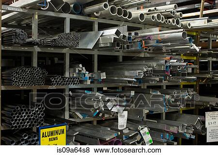 Stock Photo - Shelves of aluminum pipes in plant. Fotosearch