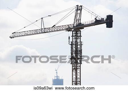 Silhouette of crane in blue sky View Large Photo Image Stock Image - Silhouette of crane in blue sky. Fotosearch