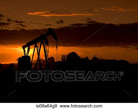 Silhouette of oil well at sunset View Large Photo Image Stock Photo - Silhouette of oil well at sunset. Fotosearch
