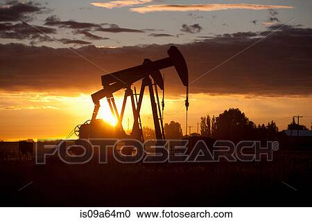 Silhouette of oil wells at sunset View Large Photo Image Stock Image - Silhouette of oil wells at sunset. Fotosearch
