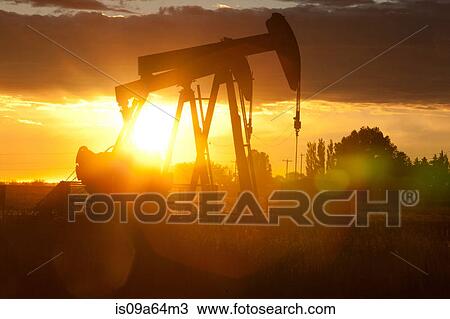 Silhouette of oil wells at sunset View Large Photo Image Stock Image - Silhouette of oil wells at sunset. Fotosearch