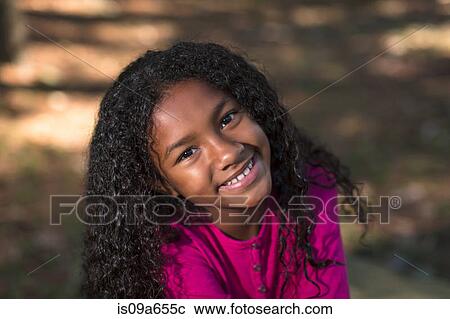 Smiling girl standing outdoors View Large Photo Image Stock Image - Smiling girl standing outdoors. Fotosearch
