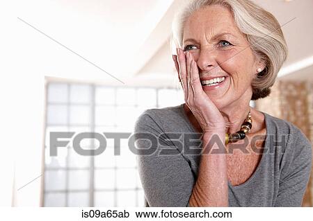 Smiling older woman gasping View Large Photo Image Stock Image - Smiling older woman gasping. Fotosearch
