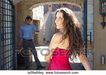 Stock Photo - Smiling woman walking outdoors. Fotosearch