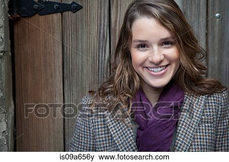 Smiling woman wearing purple scarf View Large Photo Image Stock Photo - Smiling woman wearing purple scarf. Fotosearch