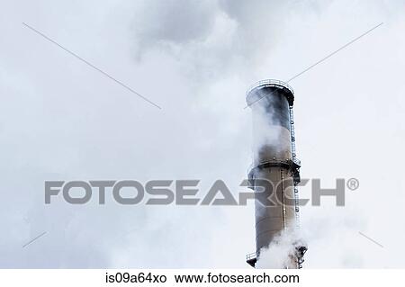 Picture - Steam from factory smokestack. Fotosearch