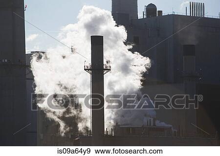 Stock Photo - Steam from factory smokestack. Fotosearch