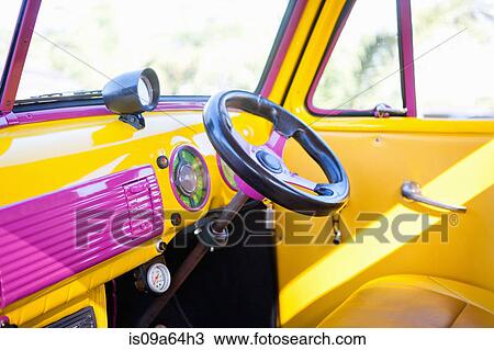 Stock Image - Steering wheel of colorful car. Fotosearch