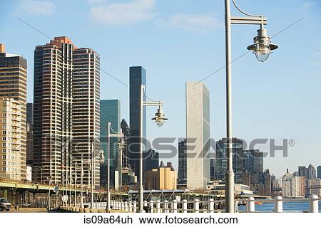 Stock Image - Streetlights and New York City skyline. Fotosearch