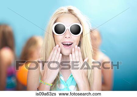 Teenage girl in sunglasses gasping View Large Photo Image Stock Photograph - Teenage girl in sunglasses gasping. Fotosearch