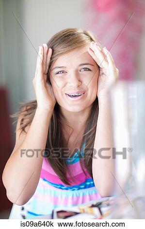 Teenage girl playing peek-a-boo View Large Photo Image Stock Image - Teenage girl playing peek-a-boo. Fotosearch