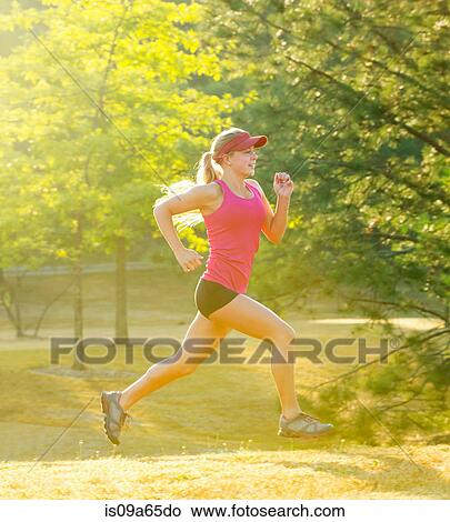 Teenage girl running in field View Large Photo Image Picture - Teenage girl running in field. Fotosearch