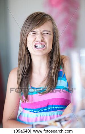 Teenage girl showing her braces View Large Photo Image Stock Image - Teenage girl showing her braces. Fotosearch