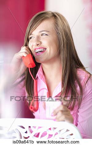 Teenage girl talking on phone View Large Photo Image Stock Image - Teenage girl talking on phone. Fotosearch