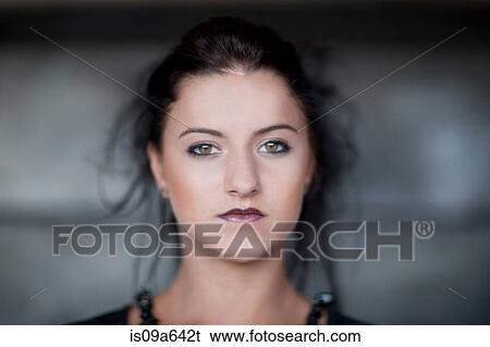 Stock Photograph - Teenage girl wearing dark makeup. Fotosearch