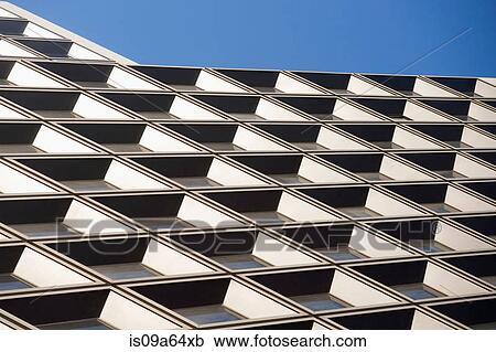 Stock Image - Tilted view of skyscraper windows. Fotosearch