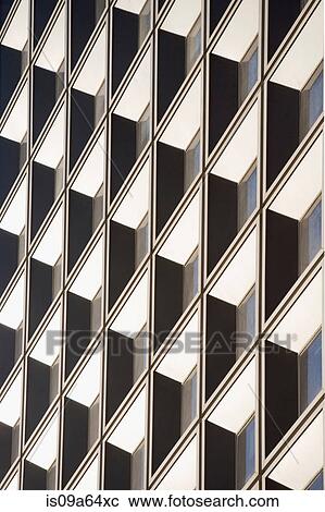 Stock Image - Tilted view of skyscraper windows. Fotosearch
