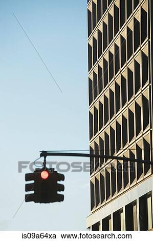 Stock Image - Traffic light and skyscraper. Fotosearch