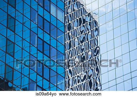 Urban skyscraper reflected in windows View Large Photo Image Picture - Urban skyscraper reflected in windows. Fotosearch