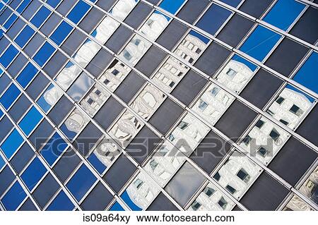 Stock Photo - Urban skyscraper reflected in windows. Fotosearch