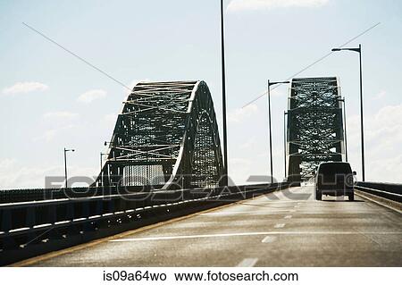 Picture - Van driving on bridge. Fotosearch