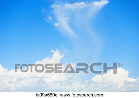 Stock Image - White clouds in blue sky. Fotosearch