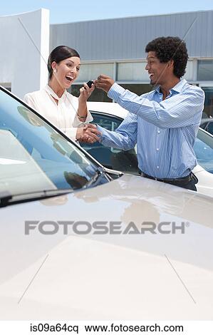 Woman buying new car from salesman View Large Photo Image Stock Photography - Woman buying new car from salesman. Fotosearch