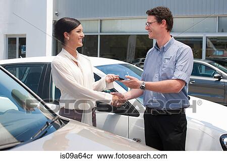 Woman buying new car from salesman View Large Photo Image Stock Photography - Woman buying new car from salesman. Fotosearch