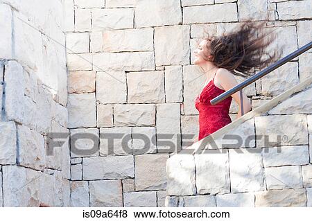 Woman climbing stone steps outdoors View Large Photo Image Stock Photo - Woman climbing stone steps outdoors. Fotosearch