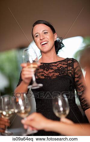 Woman giving toast in restaurant View Large Photo Image Stock Photography - Woman giving toast in restaurant. Fotosearch