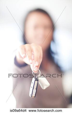 Woman holding new car keys View Large Photo Image Picture - Woman holding new car keys. Fotosearch